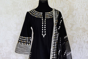 Buy ravishing black applique work silk sharara suit in USA with dupatta. Shine bright on weddings and special occasions with beautiful Indian dresses, designer lehengas from Pure Elegance Indian fashion store in USA.-front