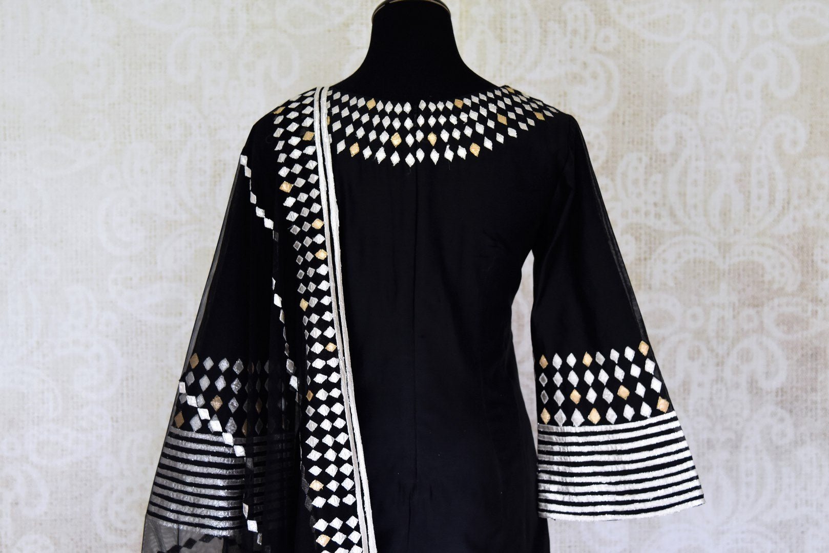 Buy ravishing black applique work silk sharara suit in USA with dupatta. Shine bright on weddings and special occasions with beautiful Indian dresses, designer lehengas from Pure Elegance Indian fashion store in USA.-back