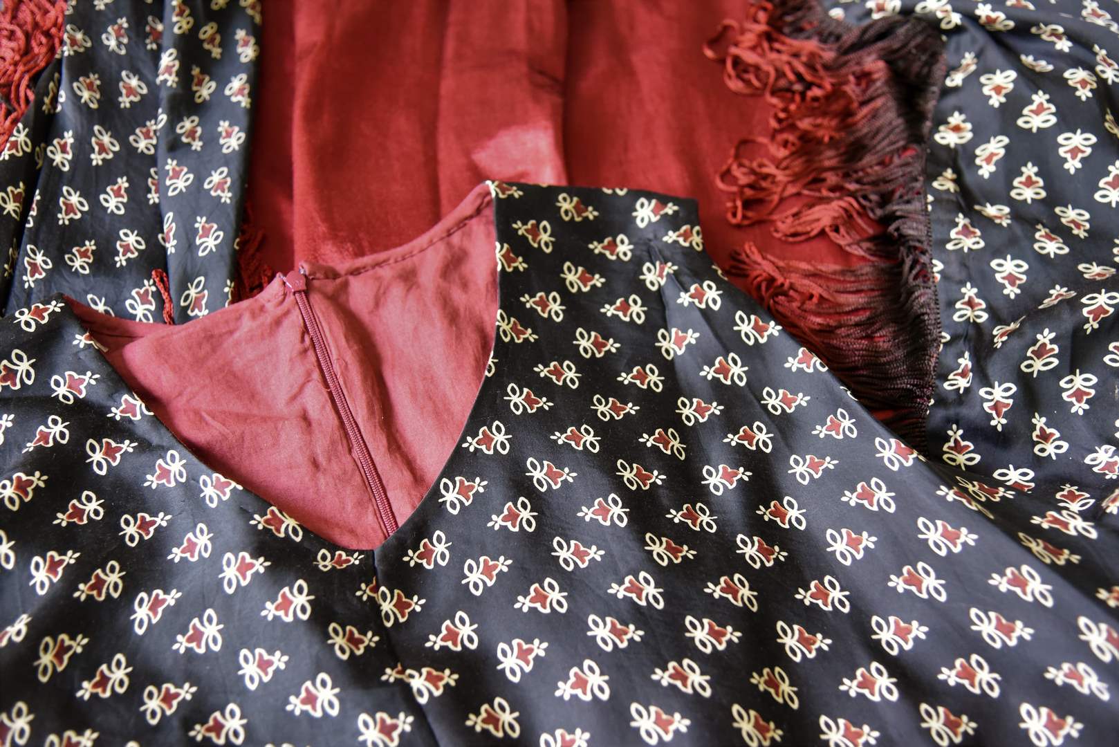 Shop black Ajrak gajji silk top online in USA with maroon pants. Be a vivid picture of ethnic fashion with an exquisite range of Indian designer clothing from Pure Elegance Indian clothing store in USA. Shop online.-details