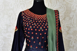 Buy navy blue embroidered silk Anarkali suit online in USA with green dupatta. Step up your ethnic fashion game with exquisite variety of designer Anarkali suits from Pure Elegance Indian clothing store in USA. Shop online.-front