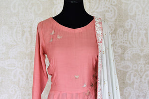 Shop pink hand embroidered silk asymmetric Anarkali online in USA with white dupatta. Elevate your traditional glam on weddings and special occasions with an exclusive range designer suits especially for Indian women in USA at Pure Elegance Indian fashion store. -front