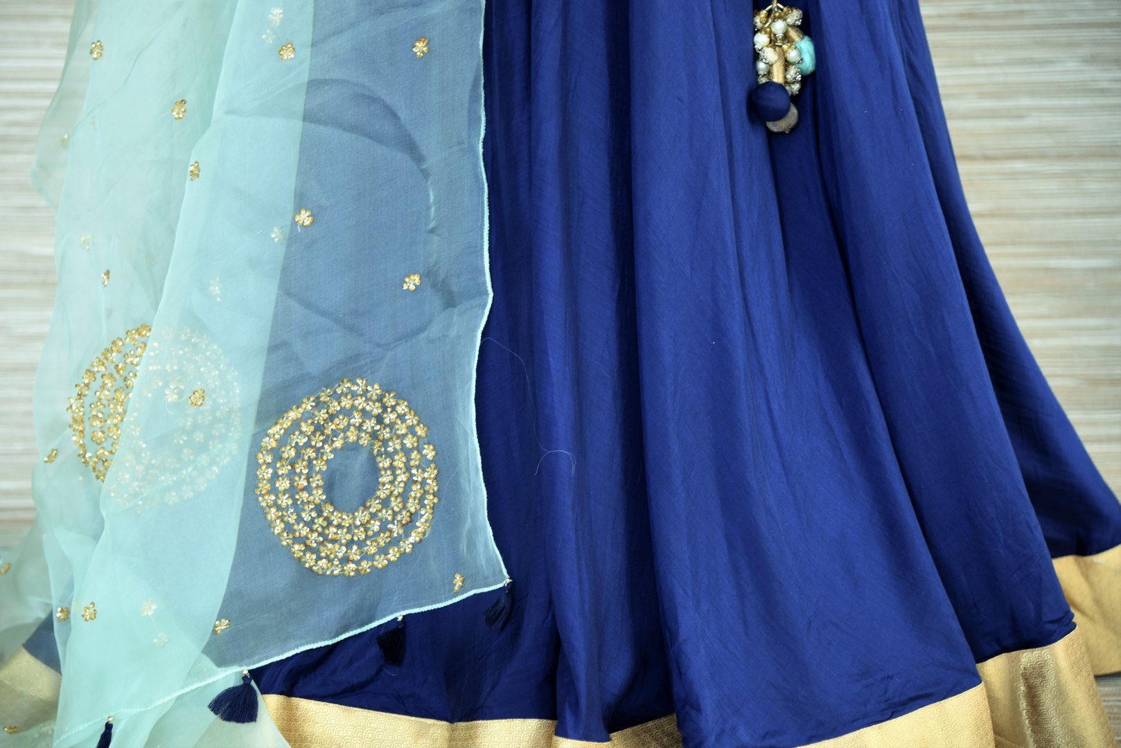 Buy beautiful dark blue chanderi silk floorlength Anarkali suit online in USA with light blue embroidered dupatta. Get your hands on exquisite Indian designer Anarkali suits in USA from Pure Elegance Indian clothing store for various special occasions like weddings and parties. Shop online now.-bottom