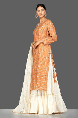 Shop beautiful orange and cream gota work chanderi cotton suit online in USA with dupatta. Be an epitome of Indian fashion with a premium range of designer suits, Anarkali dresses from Pure Elegance luxury Indian fashion store in USA. Buy online now.-side