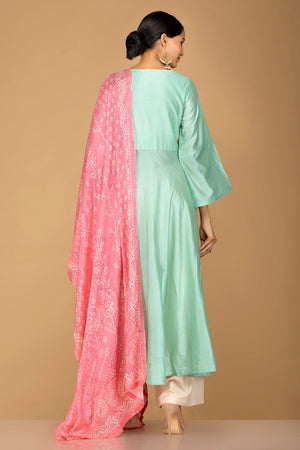 Buy elegant mint green and cream chanderi silk palazzo suit online in USA with pink dupatta. Be an epitome of Indian fashion with a premium range of designer suits, Anarkali dresses from Pure Elegance luxury Indian fashion store in USA. Buy online now.-back