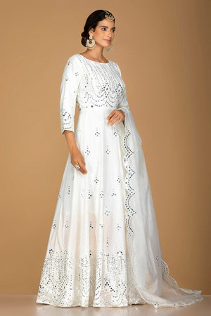 Buy gorgeous white mirror work chanderi silk Anarkali online in USA. Turn heads at weddings and festive occasions with exquiste Indian women designer clothes from Pure Elegance Indian fashion store in USA. Shop now.-side