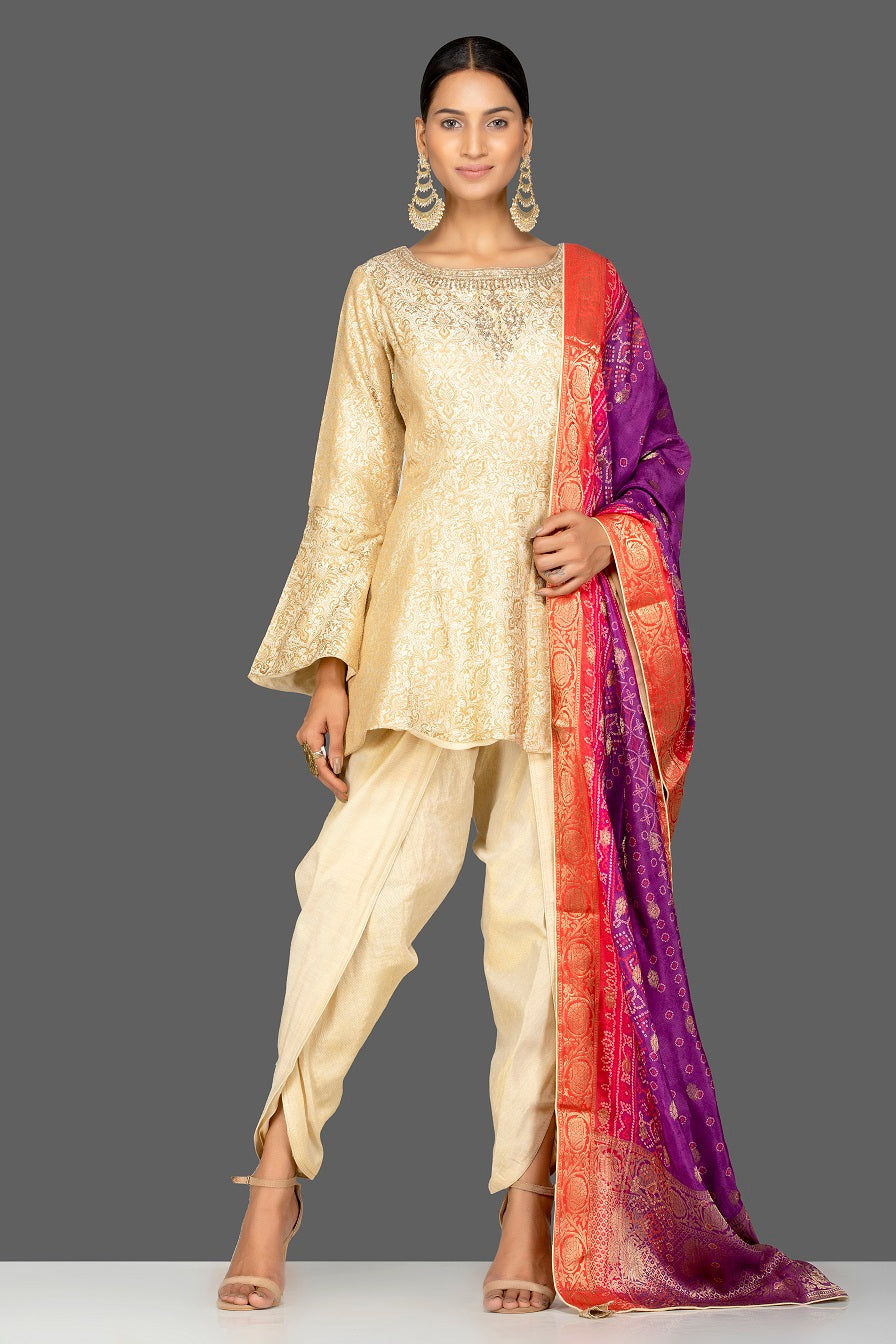 Buy cream embroidered brocade silk salwar suit online in USA with bandhej dupatta. Shop exquisite Indian designer clothes for women from Pure Elegance Indian boutique in USA. We have a splendid variety of designer Anarkali suits, traditional salwar suits, sharara suits  for parties and weddings all under one roof.-front