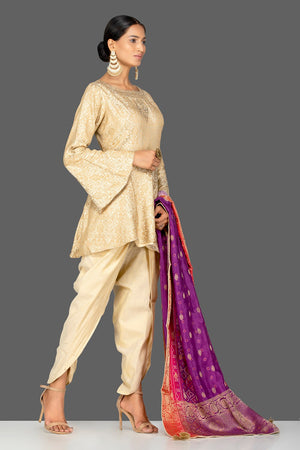 Buy cream embroidered brocade silk salwar suit online in USA with bandhej dupatta. Shop exquisite Indian designer clothes for women from Pure Elegance Indian boutique in USA. We have a splendid variety of designer Anarkali suits, traditional salwar suits, sharara suits  for parties and weddings all under one roof.-side