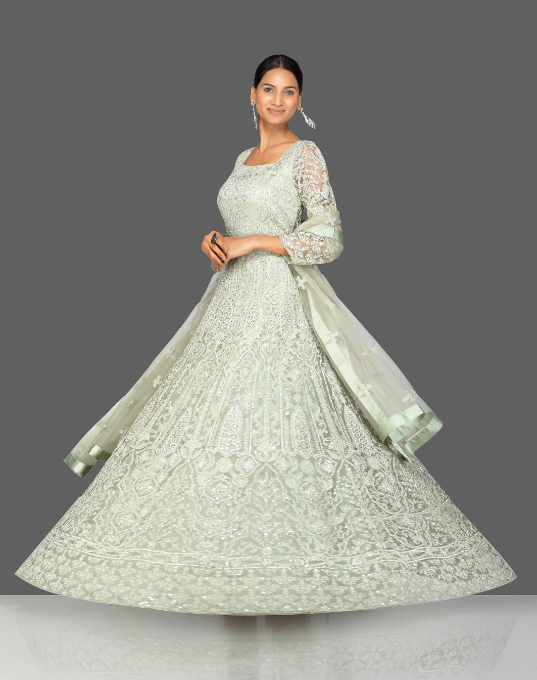 Shop grey stone and resham embroidery net Anarkali online in USA with dupatta. Make a stunning fashion statement at weddings and special occasions with an exquisite collection of designer Anarkali suits, traditional salwar suits, bridal lehengas from Pure Elegance Indian fashion store in USA. -side view