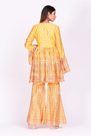 Shop contemporary yellow printed silk sharara set online in USA. Make a stunning fashion statement at weddings and special occasions with an exquisite collection of designer Anarkali suits, traditional salwar suits, designer lehengas from Pure Elegance Indian fashion store in USA. -back