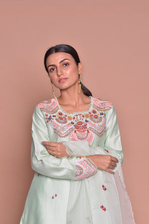 Shop elegant mint green embroidered suit online in USA with palazzo and dupatta. Flaunt Indian fashion with exquisite designer suits, Anarkali suits, sharara suits from Pure Elegance Indian cloth store in USA. -closeup