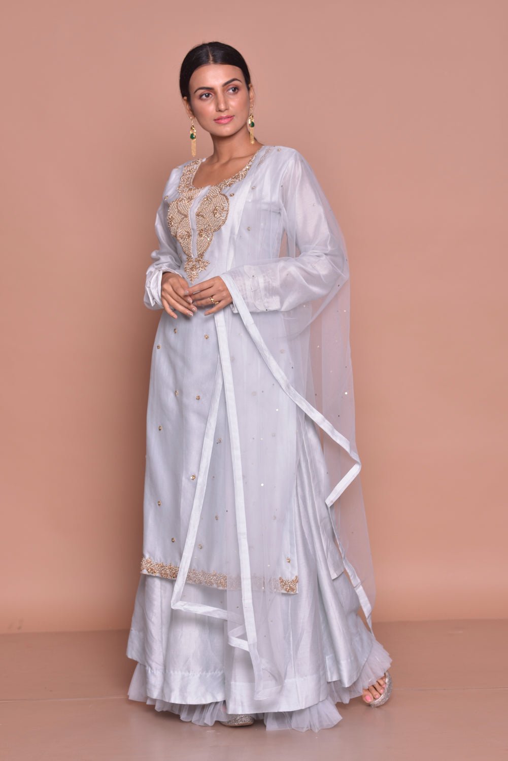 Shop stunning white embroidered kurta with skirt online in USA and dupatta. Flaunt Indian fashion with exquisite designer suits, Anarkali suits, sharara suits from Pure Elegance Indian cloth store in USA. -side