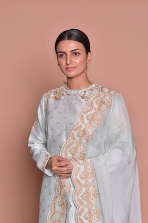 Buy gorgeous powder blue embroidered suit online in USA with embroidered palazzo and embroidered dupatta. Flaunt Indian fashion with exquisite designer suits, Anarkali dresses, traditional salwar suits from Pure Elegance Indian cloth store in USA. -closeup