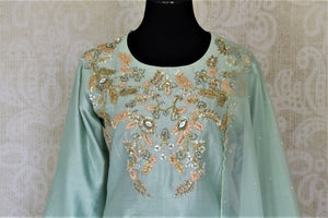 Buy beautiful tea green embroidered silk kurta with skirt online in USA and dupatta. Get spoiled for choices with a myriad of designer Indian dresses, wedding lehengas from Pure Elegance Indian fashion store in USA.-front