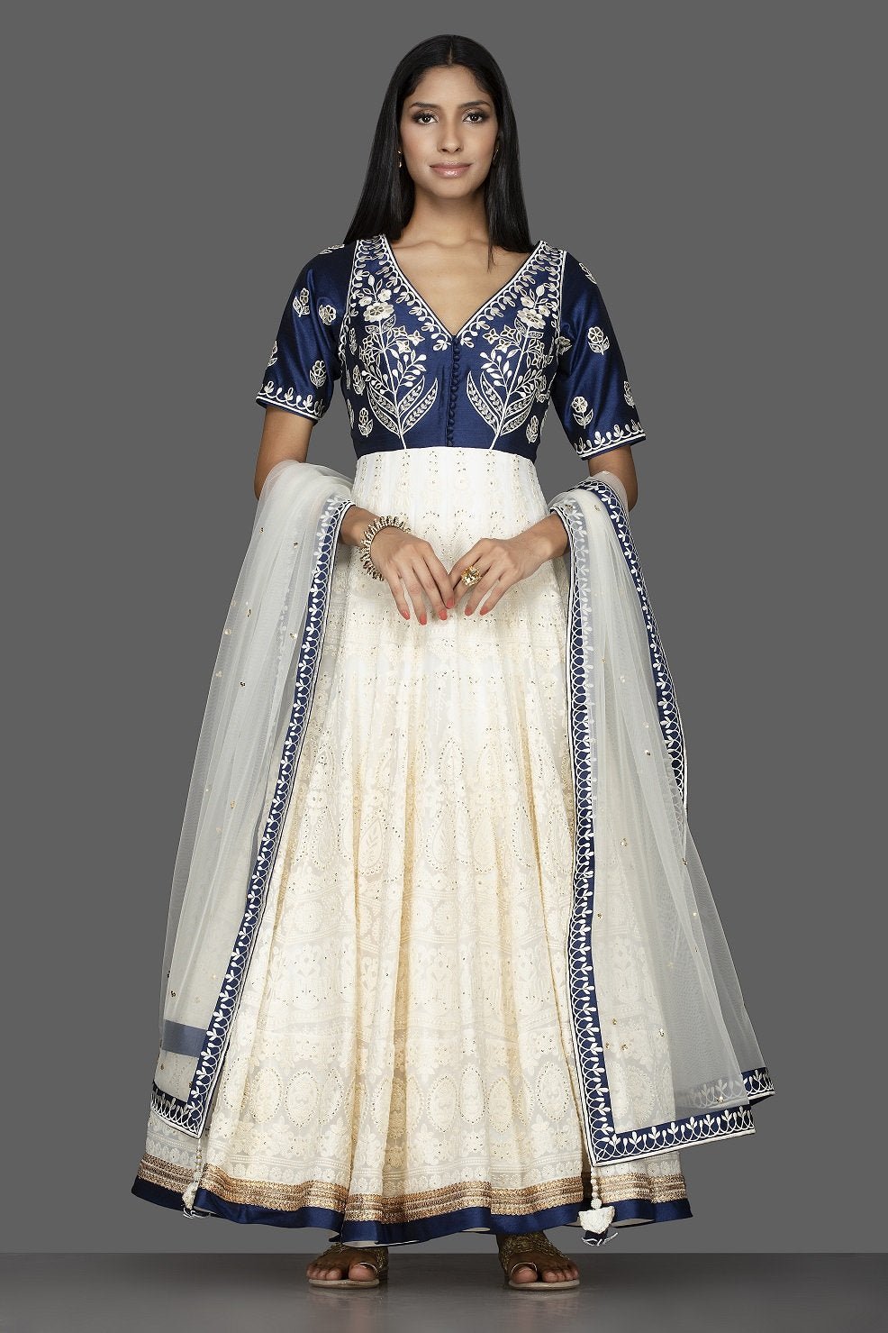 Buy beautiful off-white and blue Lucknowi work georgette Anarkali suit online in USA with dupatta. Spread ethnic elegance on weddings and special occasions in splendid designer lehengas, Anarkali suits crafted with exquisite Indian craftsmanship from Pure Elegance Indian fashion store in USA.-full view