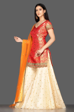 Shop beautiful red and cream embroidered net and Banarasi sharara suit online in USA with dupatta. Spread ethnic elegance on weddings and special occasions in splendid designer lehengas, Anarkali suits crafted with exquisite Indian craftsmanship from Pure Elegance Indian fashion store in USA.-side