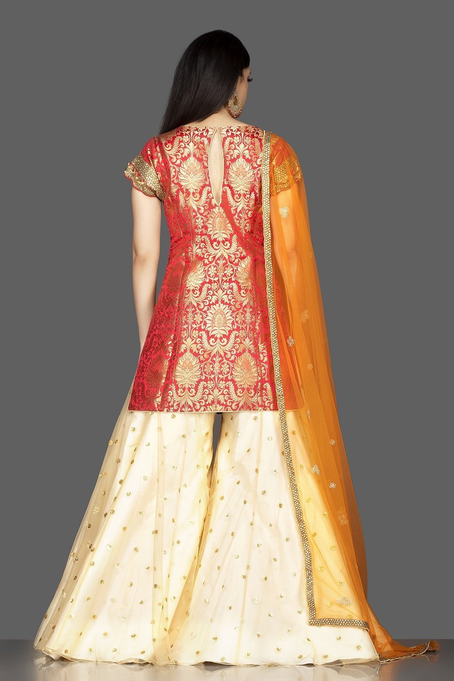 Shop beautiful red and cream embroidered net and Banarasi sharara suit online in USA with dupatta. Spread ethnic elegance on weddings and special occasions in splendid designer lehengas, Anarkali suits crafted with exquisite Indian craftsmanship from Pure Elegance Indian fashion store in USA.-back
