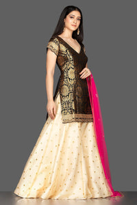 Buy gorgeous black and cream embroidered net and Banarasi sharara suit online in USA with pink dupatta. Spread ethnic elegance on weddings and special occasions in splendid designer lehengas, Anarkali suits crafted with exquisite Indian craftsmanship from Pure Elegance Indian fashion store in USA.-full view