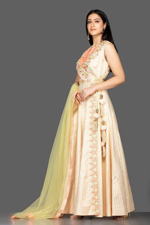 Buy beautiful cream embroidered Banarasi cotton Anarkali suit online in USA with yellow dupatta. Spread ethnic elegance on weddings and special occasions in splendid designer lehengas, Anarkali suits crafted with exquisite Indian craftsmanship from Pure Elegance Indian fashion store in USA.-side