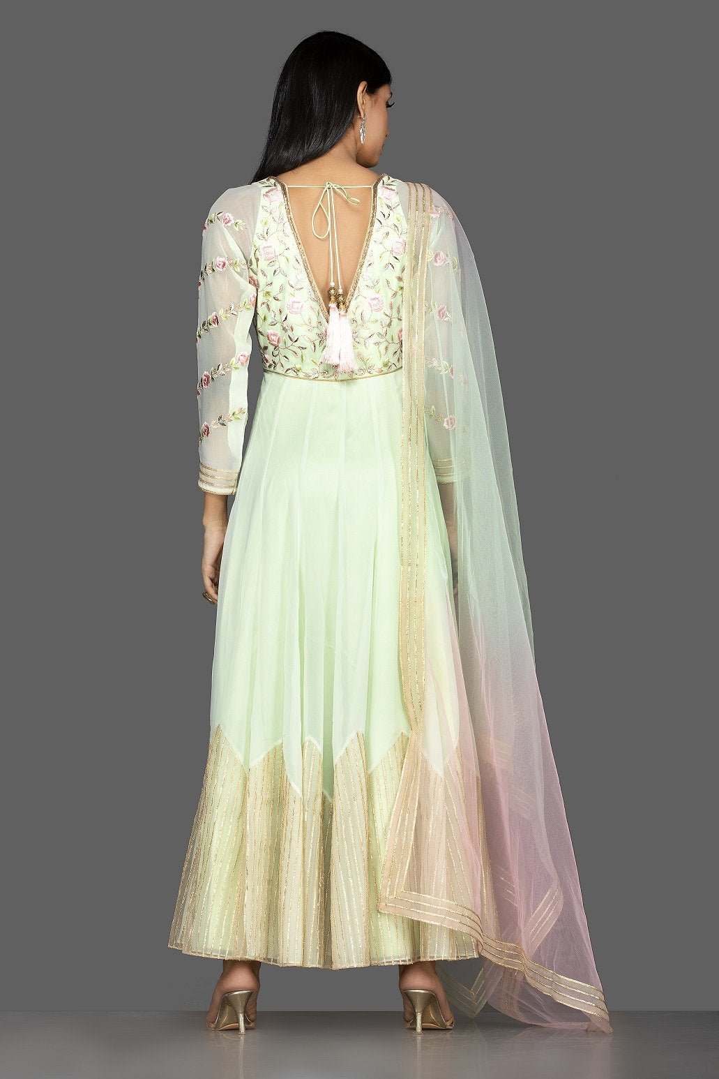 Buy mint green embroidered net floorlength Anarkali online in USA with dupatta. Spread ethnic elegance on weddings and special occasions in splendid designer lehengas, Anarkali suits crafted with exquisite Indian craftsmanship from Pure Elegance Indian fashion store in USA.-back