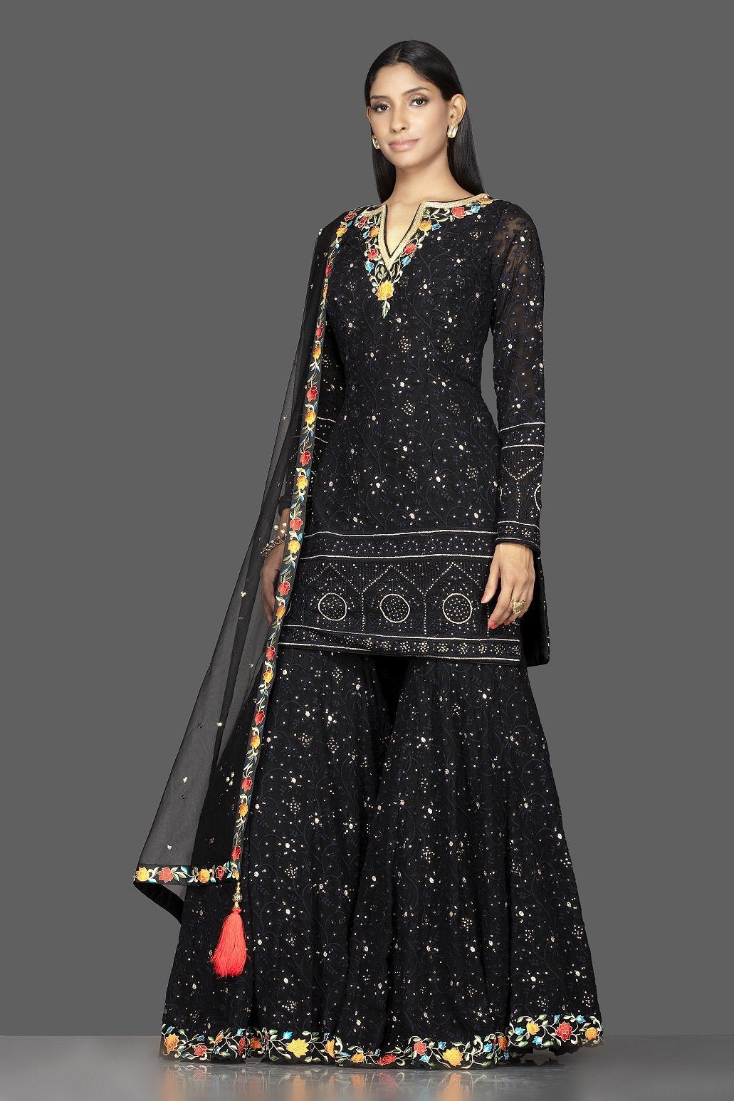 Buy stunning black georgette Lucknowi work garara suit online in USA with dupatta. Spread ethnic elegance on weddings and special occasions in splendid designer lehengas, Anarkali suits crafted with exquisite Indian craftsmanship from Pure Elegance Indian fashion store in USA.-side