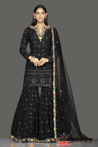 Buy stunning black georgette Lucknowi work garara suit online in USA with dupatta. Spread ethnic elegance on weddings and special occasions in splendid designer lehengas, Anarkali suits crafted with exquisite Indian craftsmanship from Pure Elegance Indian fashion store in USA.-full view