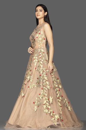 Shop gorgeous beige designer net gown online in USA with golden applique work. Look radiant on weddings and special occasions in splendid designer Indian dresses, wedding lehengas crafted with finest embroideries and stunning silhouettes from Pure Elegance Indian fashion boutique in USA.-side