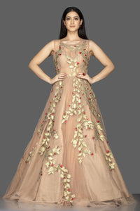 Shop gorgeous beige designer net gown online in USA with golden applique work. Look radiant on weddings and special occasions in splendid designer Indian dresses, wedding lehengas crafted with finest embroideries and stunning silhouettes from Pure Elegance Indian fashion boutique in USA.-full view