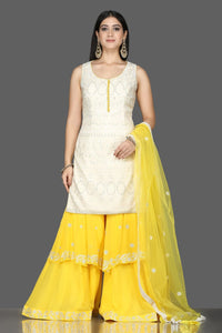 Shop white Lucknowi kurta online in USA with yellow georgette sharara. Flaunt ethnic fashion with exquisite designer lehenga, Indian wedding dresses, Anarkali suits from Pure Elegance Indian fashion boutique in USA.-full view