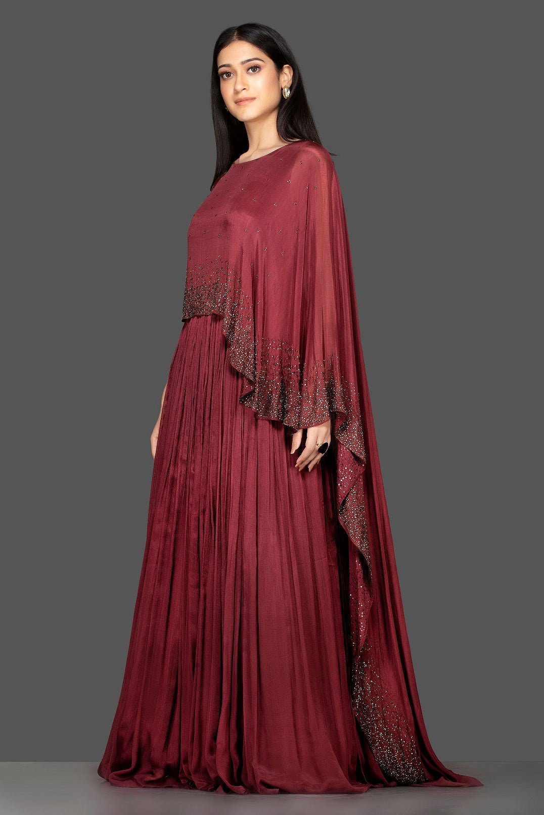 Buy stunning maroon embroidered satin silk cape gown online in USA. Flaunt your extraordinary fashion sense with stunning Indian dresses, designer gowns from Pure Elegance Indian fashion store in USA.-side