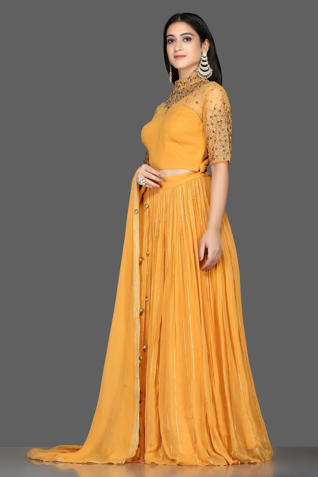 Shop beautiful mustard embroidered georgette lehenga online in USA with dupatta. Flaunt your extraordinary fashion sense with stunning Indian dresses, designer lehenga from Pure Elegance Indian fashion store in USA.-side