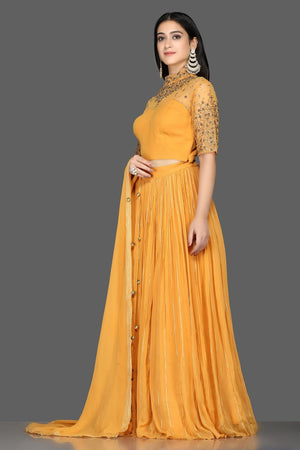 Shop beautiful mustard embroidered georgette lehenga online in USA with dupatta. Flaunt your extraordinary fashion sense with stunning Indian dresses, designer lehenga from Pure Elegance Indian fashion store in USA.-side