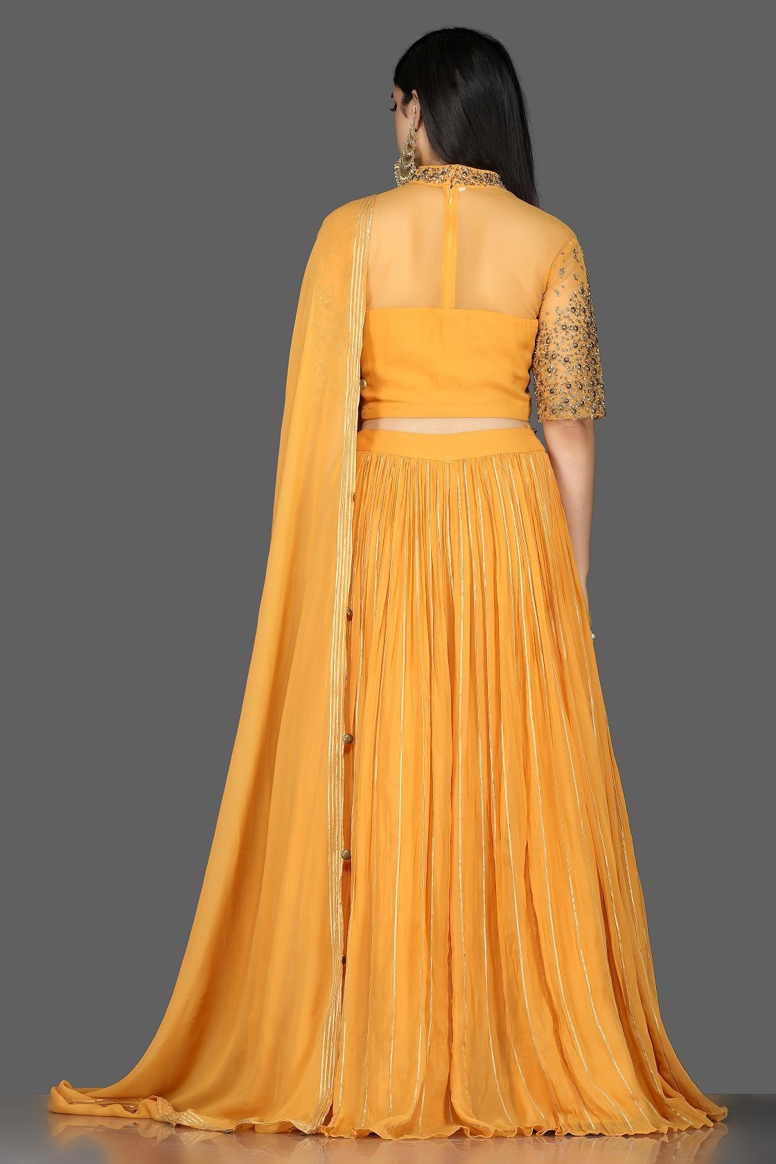 Shop beautiful mustard embroidered georgette lehenga online in USA with dupatta. Flaunt your extraordinary fashion sense with stunning Indian dresses, designer lehenga from Pure Elegance Indian fashion store in USA.-back