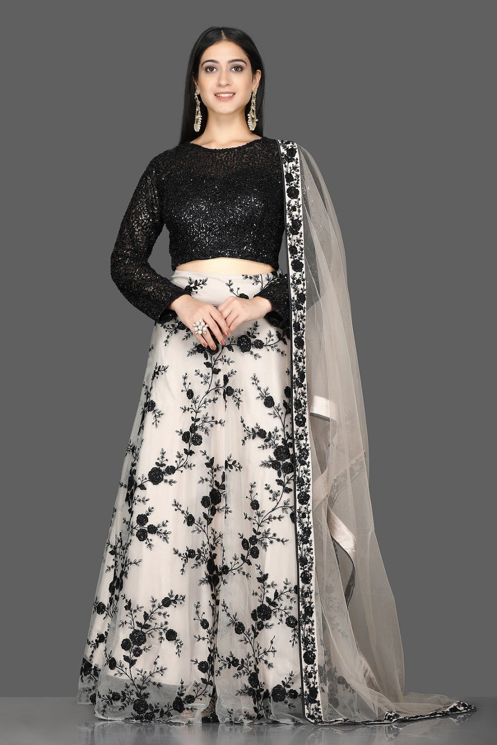 Shop stunning black sequin blouse with embroidered net skirt online in USA and dupatta. Flaunt your extraordinary fashion sense with stunning Indian dresses, designer lehenga from Pure Elegance Indian fashion store in USA.-full view