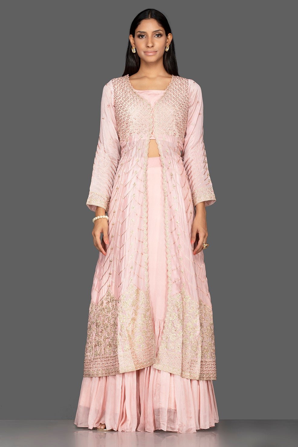 Buy powder pink top and skirt online in USA with embroidered long jacket. Flaunt your extraordinary fashion sense with stunning Indowestern dresses, designer Anarkali suits from Pure Elegance Indian fashion store in USA.-full view