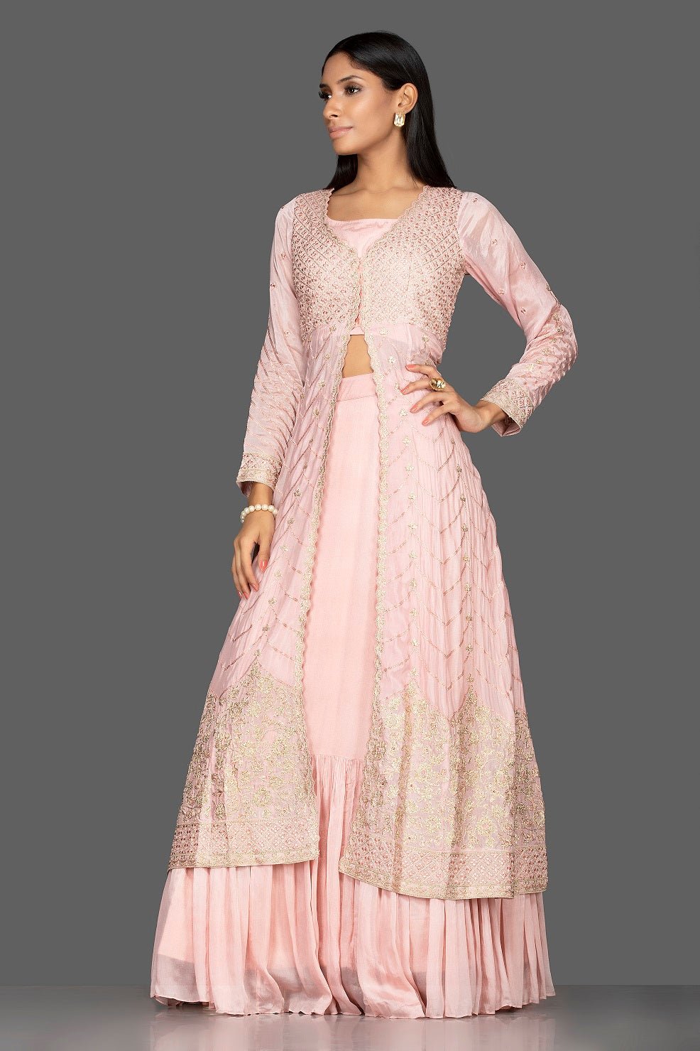 Buy powder pink top and skirt online in USA with embroidered long jacket. Flaunt your extraordinary fashion sense with stunning Indowestern dresses, designer Anarkali suits from Pure Elegance Indian fashion store in USA.-side