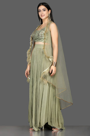 Buy olive green embroidered crop top with palazzo online in USA with faux feather cape. Shine at weddings and special occasions with beautiful designer Indian dresses, Anarkali suits from Pure Elegance Indian clothing store in USA.-side