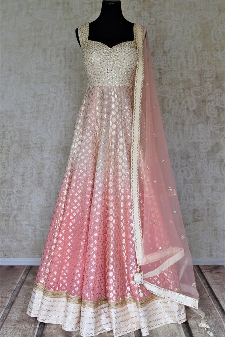 Buy beautiful ombre pink embroidered silk floorlength Anarkali suit online in USA with lace work. Dazzle at weddings and festive occasions with stunning designer Anarkalis from Pure Elegance Indian fashion store in USA.-full view