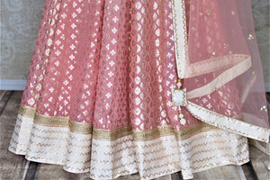 Buy beautiful ombre pink embroidered silk floorlength Anarkali suit online in USA with lace work. Dazzle at weddings and festive occasions with stunning designer Anarkalis from Pure Elegance Indian fashion store in USA.-bottom