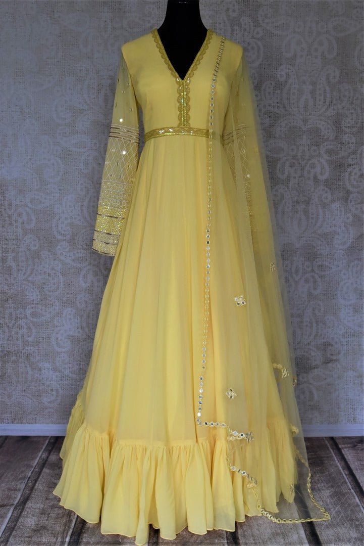 Buy stunning yellow hand embroidered georgette Anarkali online in USA with dupatta. Dazzle at weddings and festive occasions with stunning designer sharara and Anarkali suits from Pure Elegance Indian fashion store in USA.-full view