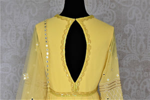 Buy stunning yellow hand embroidered georgette Anarkali online in USA with dupatta. Dazzle at weddings and festive occasions with stunning designer sharara and Anarkali suits from Pure Elegance Indian fashion store in USA.- back