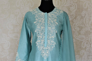 Buy alluring light blue pearl embroidery silk suit with palazzo online in USA and dupatta. Dazzle at weddings and festive occasions with stunning designer sharara and Anarkali suits from Pure Elegance Indian fashion store in USA.-front