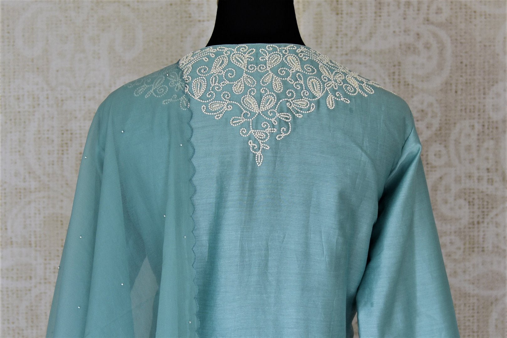 Buy alluring light blue pearl embroidery silk suit with palazzo online in USA and dupatta. Dazzle at weddings and festive occasions with stunning designer sharara and Anarkali suits from Pure Elegance Indian fashion store in USA.-back