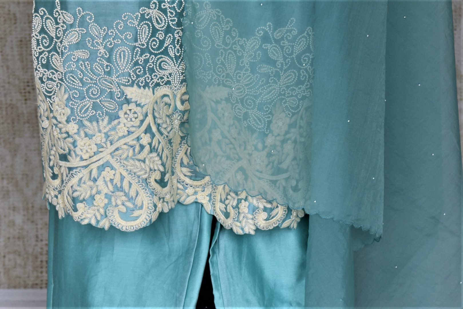 Buy alluring light blue pearl embroidery silk suit with palazzo online in USA and dupatta. Dazzle at weddings and festive occasions with stunning designer sharara and Anarkali suits from Pure Elegance Indian fashion store in USA.-bottom