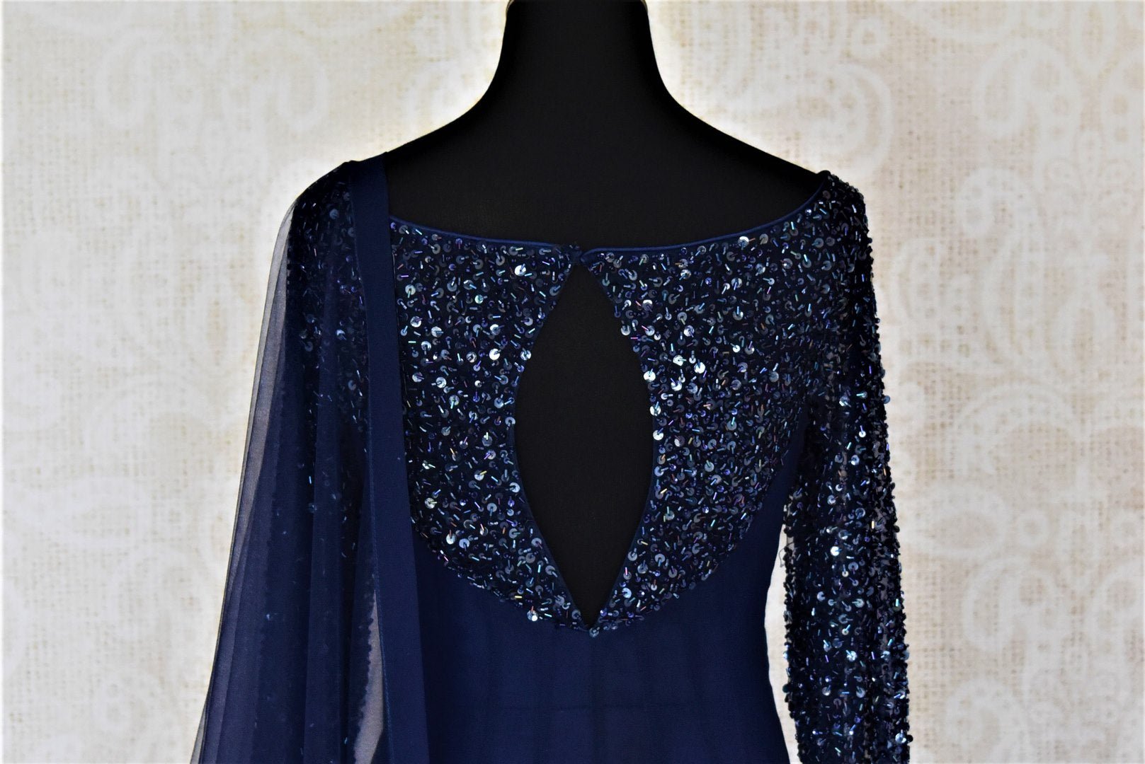 Shop contemporary dark blue hand embroidered georgette boat-neck Anarkali online in USA with dupatta. Dazzle at weddings and festive occasions with stunning designer sharara and Anarkali suits from Pure Elegance Indian fashion store in USA.-back