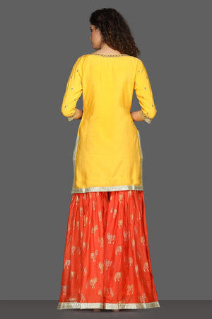 Buy bright yellow and red embroidered sharara suit online in USA with printed dupatta. Dazzle on weddings and special occasions with exquisite Indian designer dresses, sharara suits, Anarkali suits from Pure Elegance Indian fashion store in USA.-back