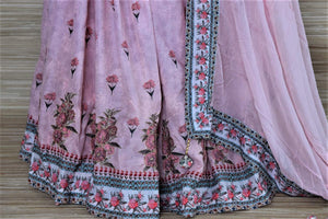 Buy stunning powder pink floral embroidered silk sharara suit online in USA with dupatta. Choose from a splendid variety of sharara suits, Anarkali suits, designer lehenga for weddings and festive occasions from Pure Elegance Indian clothing store in USA.-bottom