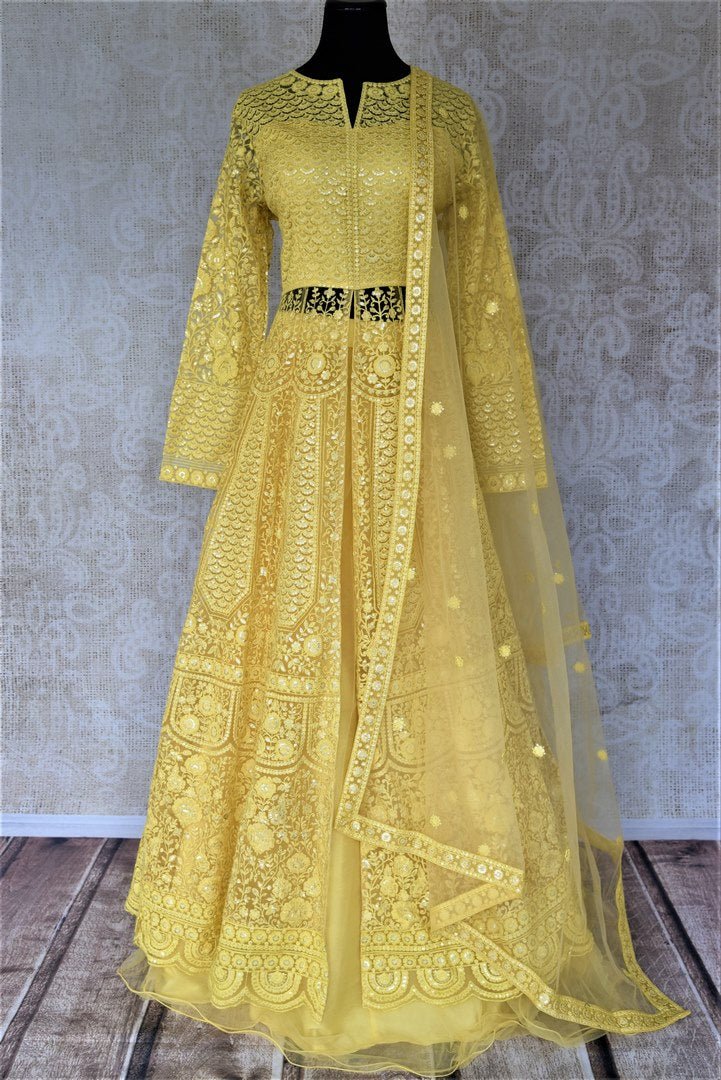 Shop gorgeous yellow embroidered net Anarkali with dupatta online in USA. Flaunt your sartorial choices on special occasions with beautiful designer dresses, Anarkali suits, traditional salwar suits, Indian lehengas from Pure Elegance Indian fashion boutique in USA. -full view