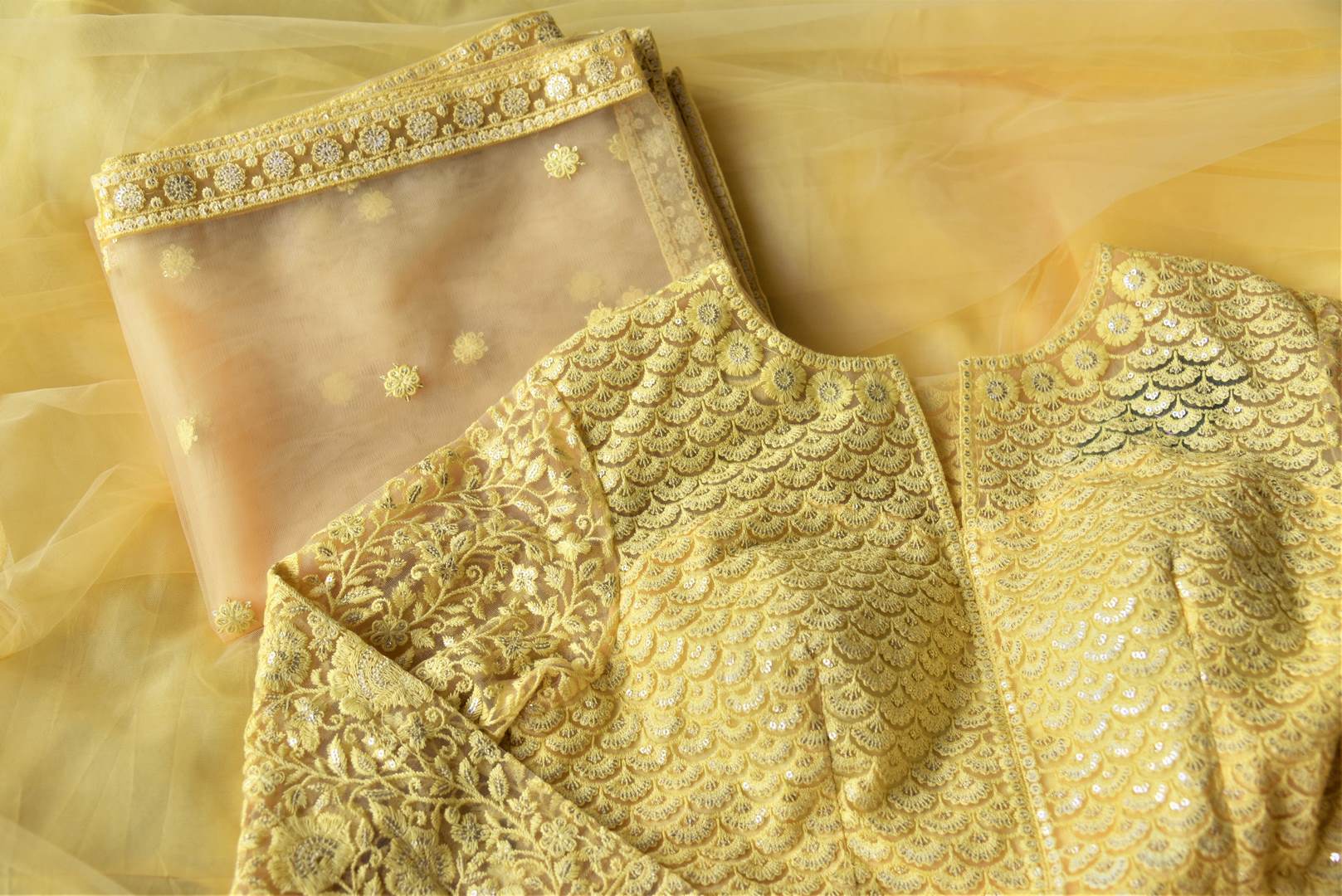 Shop gorgeous yellow embroidered net Anarkali with dupatta online in USA. Flaunt your sartorial choices on special occasions with beautiful designer dresses, Anarkali suits, traditional salwar suits, Indian lehengas from Pure Elegance Indian fashion boutique in USA. -details