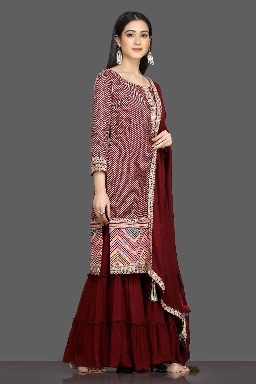 Shop beautiful wine color embroidered sharara suit with dupatta online in USA. Flaunt your sartorial choices on special occasions with beautiful designer dresses, Anarkali suits, traditional salwar suits, Indian lehengas from Pure Elegance Indian fashion boutique in USA. -side