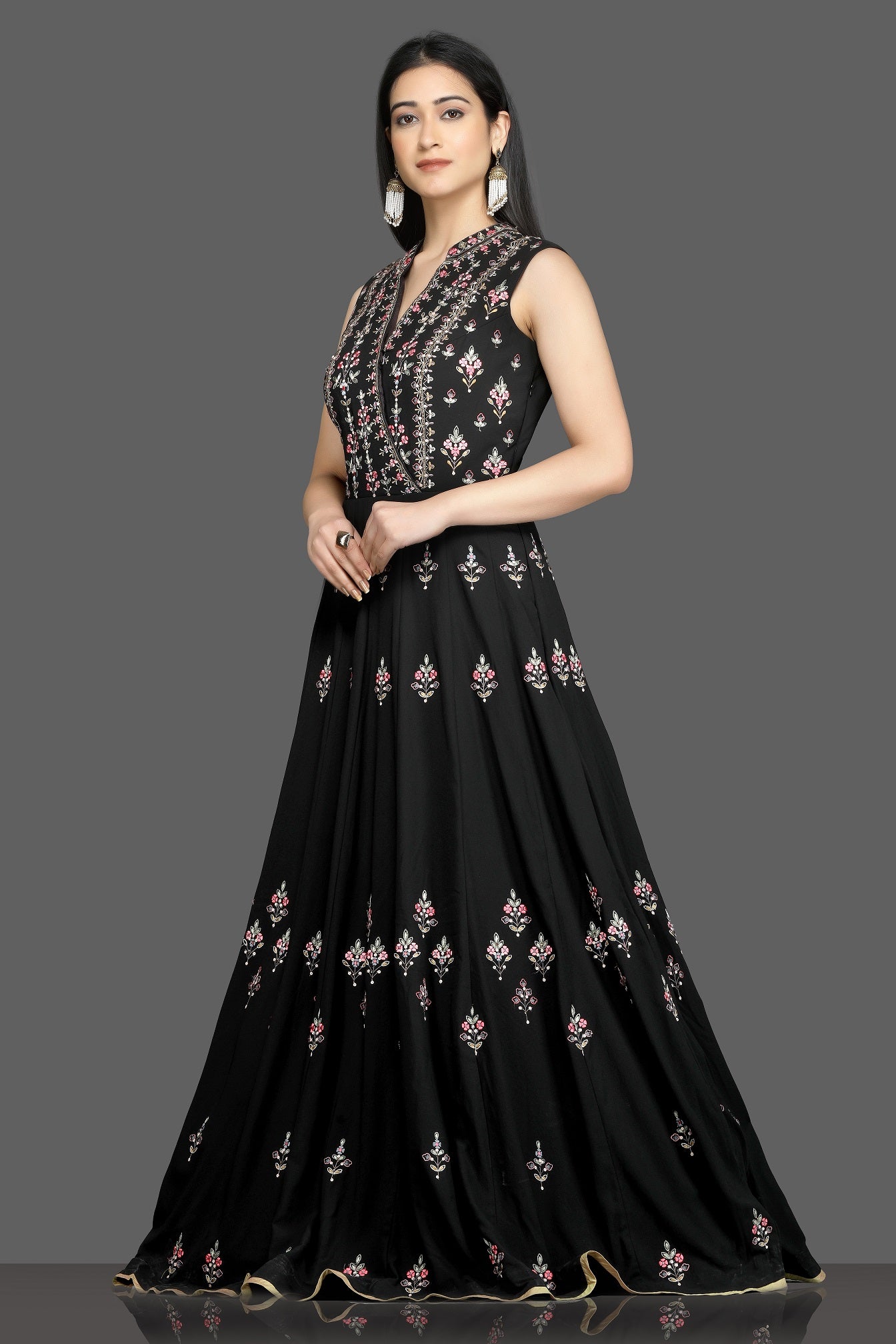 Shop gorgeous black embroidered sleeveless Anarkali gown online in USA. Flaunt your sartorial choices on special occasions with beautiful designer gowns, Anarkali suits, traditional salwar suits, Indian lehengas from Pure Elegance Indian fashion boutique in USA. -left
